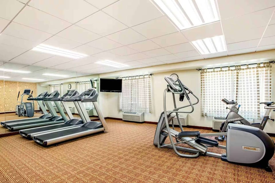 Fitness room with treadmills, bikes, and cardio equipment