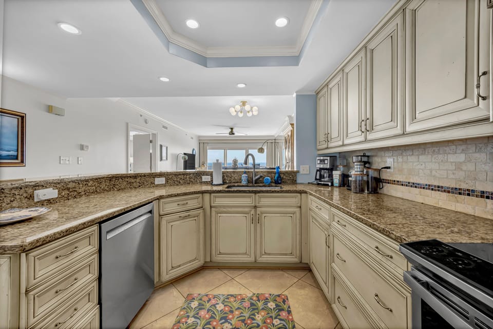 Step into your fully equipped kitchen with granite countertops, custom cabinetry, and modern appliances—perfect for preparing family meals or morning coffee before heading out to explore.