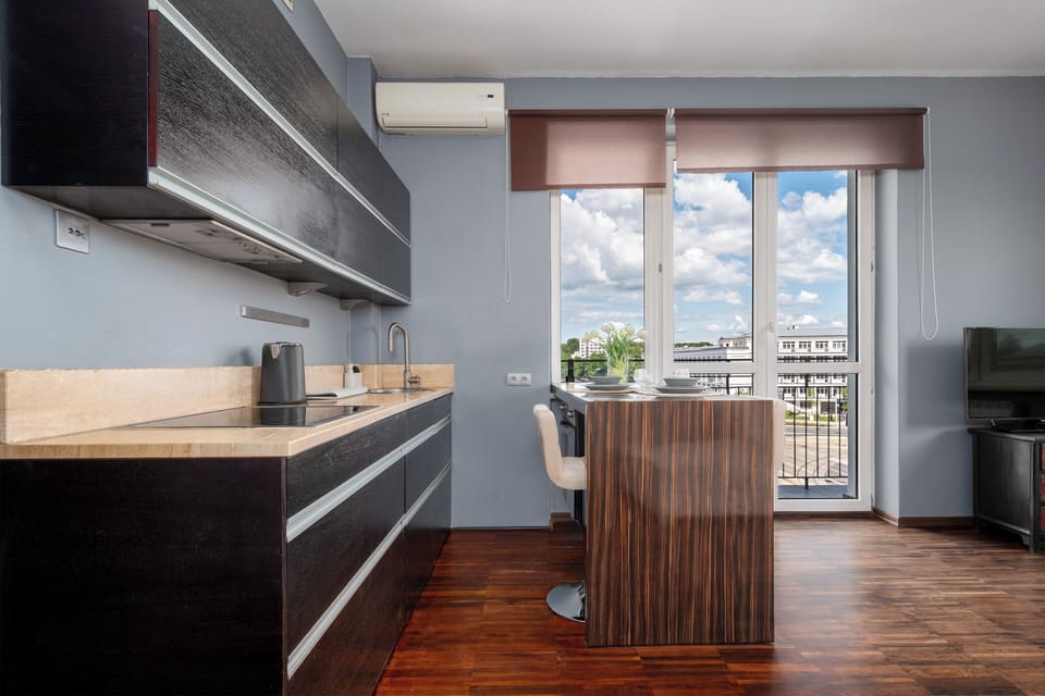 Apartment, Balcony | Private kitchen | Fridge, stovetop, electric kettle, cookware/dishes/utensils