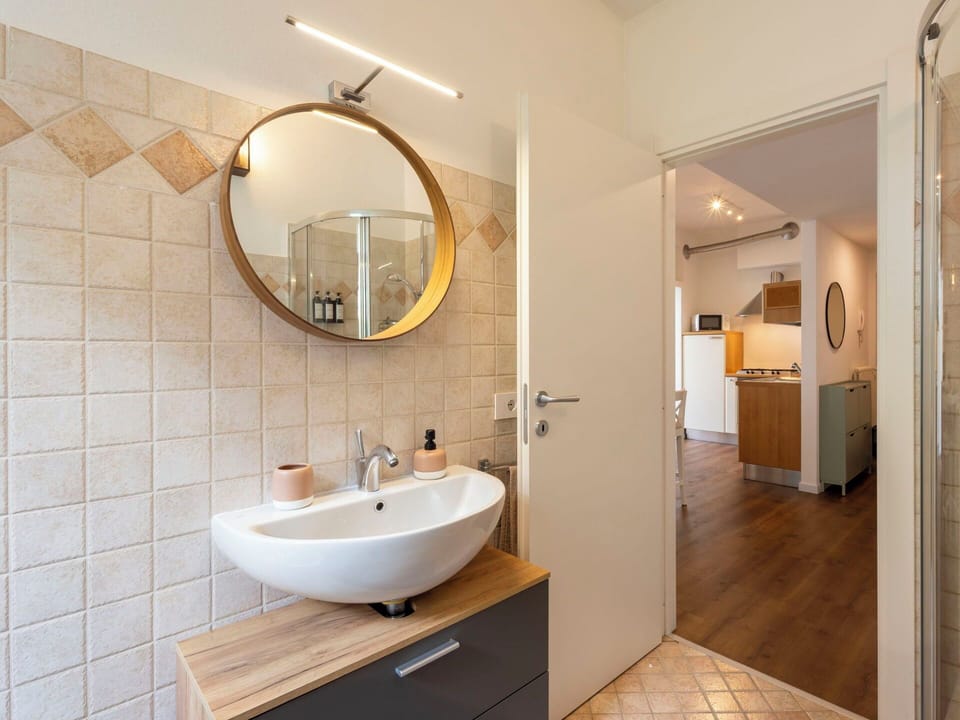 Flooring, Floor, Ceiling, Interior Design, Countertop, Kitchen, Cabinetry, Room, Major Appliance, Light Fixture