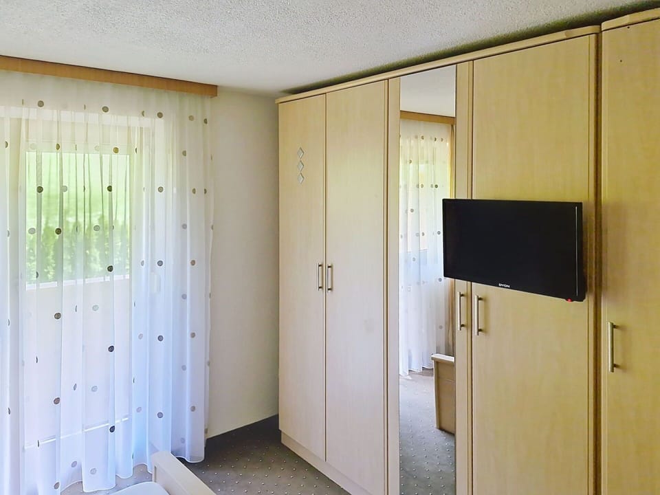 Wood, Interior Design, Flooring, Floor, Furniture, Room, Ceiling, Door, Curtain, Cupboard