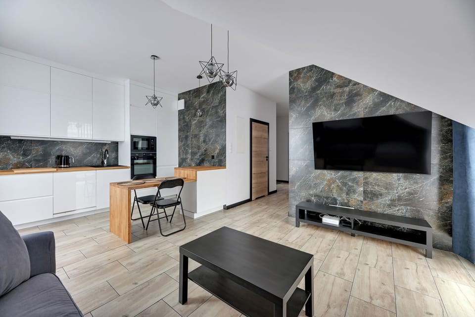 Deluxe Apartment, Balcony, Courtyard View | Living area | 40-inch flat-screen TV with cable channels, Netflix, Hulu