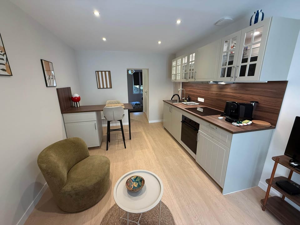 Living and dining area with equipped kitchen.