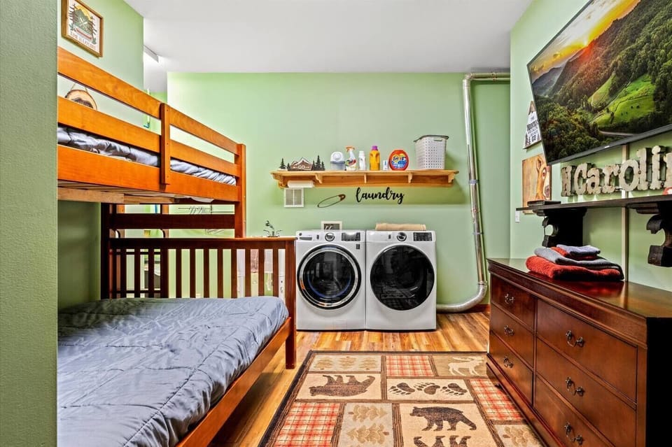 Bedroom #4: Convenient laundry room with extra sleeping space; a bunk bed featuring a full on the bottom and a twin on top.