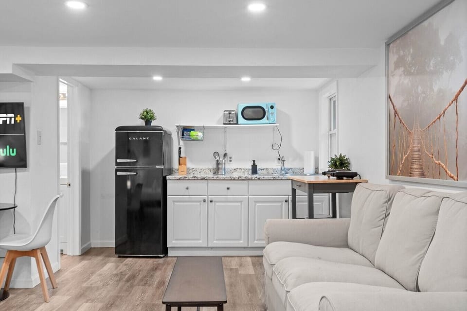 The retro kitchenette flows right into the living space, with full-size fridge and granite prep counters.