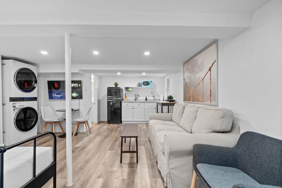 Lounge on the sofa and stream your favorite shows on the wall-mounted Smart TV, steps from the kitchenette.
