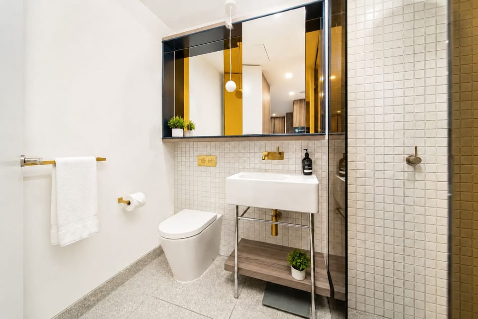 Stylish modern bathroom with walk-in shower and upscale finishes