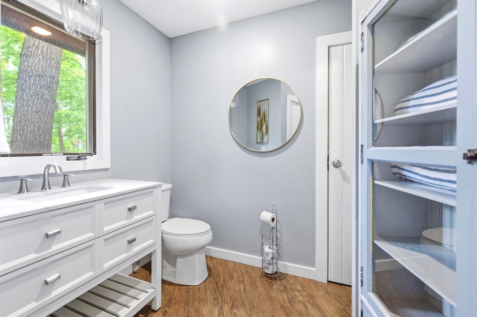 Convenient half bath located off the main living area.