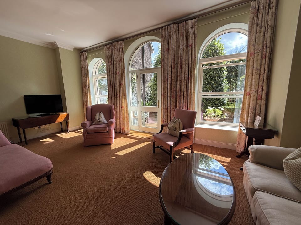 Luxury Double Room, Patio, Garden View | Living area | 32-inch Smart TV with cable channels