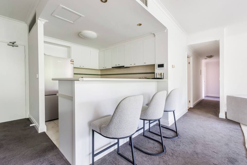 The breakfast bar offers an inviting spot for morning coffee or casual meals shared between adventures.