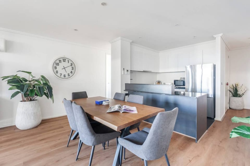 Gather around the dining table for relaxed dinners or casual work sessions, all within the open-plan layout.