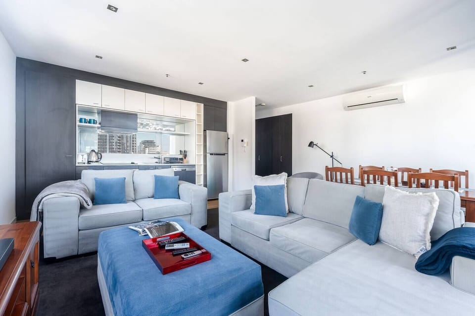 The open-plan layout brings the living, dining, and kitchen together in one seamless, connected space.