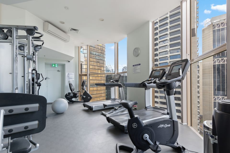 Keep up your routine in the shared gym, where cardio and strength equipment are complemented by impressive city views.