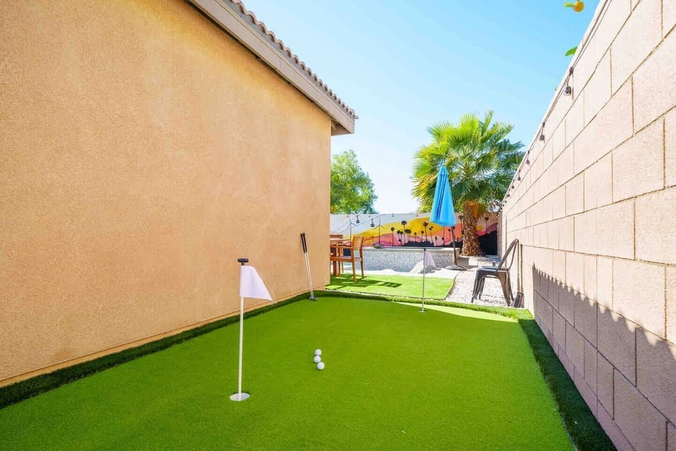 Practice your short game on the private backyard putting green—an extra amenity for golfers, families, and groups enjoying an Indio desert vacation.
