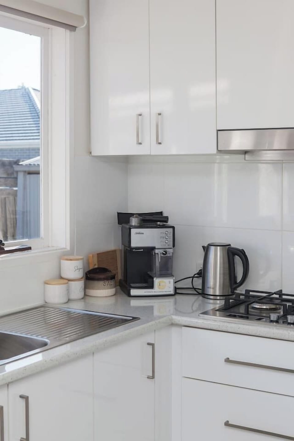 Start your day right with a fresh brew from the espresso machine, surrounded by thoughtful touches and cooking essentials.