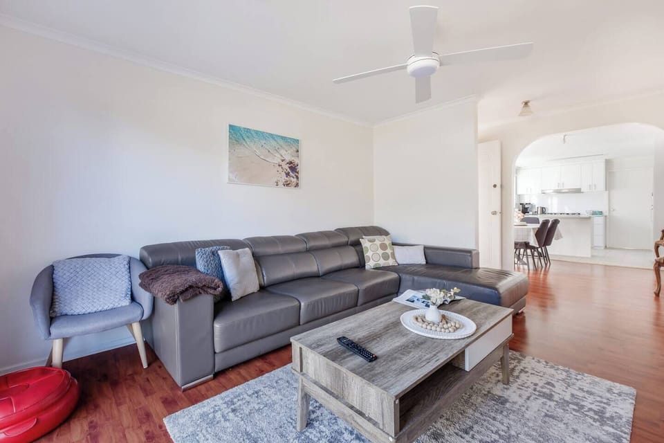 Connect easily with the kitchen and dining area from the central living zone, perfect for both lazy mornings and lively evenings.