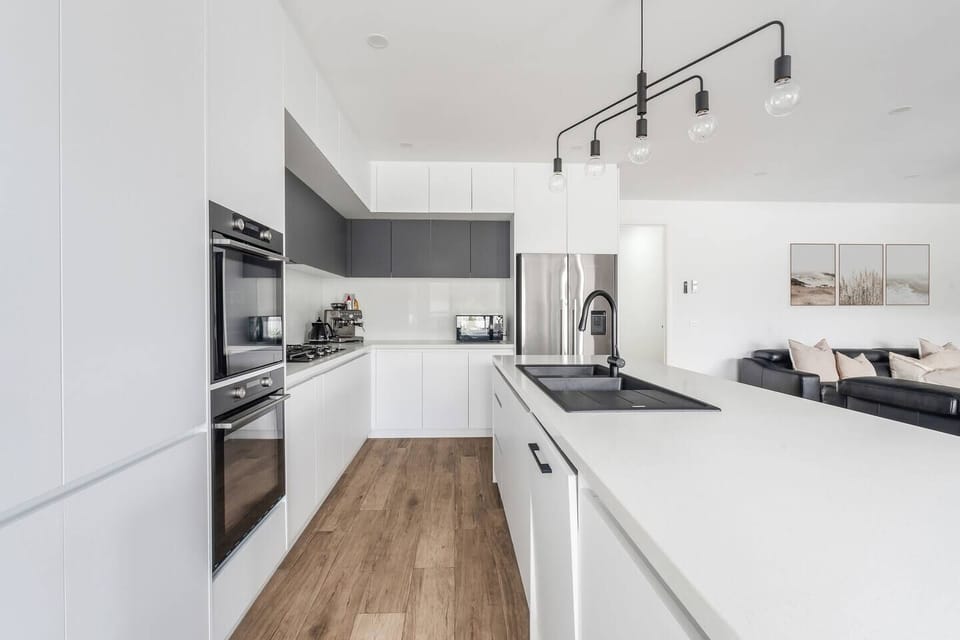 From morning coffee to family dinners, the open kitchen creates a welcoming space to cook, gather, and settle into coastal living.