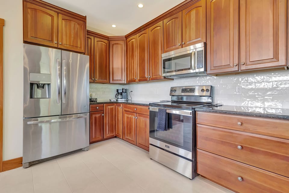 Large stainless fridge, and plenty of cooking supplies 