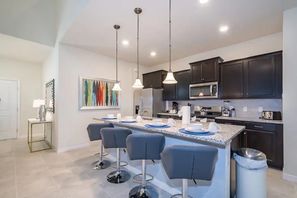 Spacious kitchen with island and breakfast bar