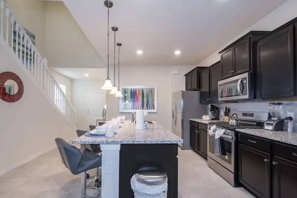 Modern kitchen with breakfast bar and ample counter space