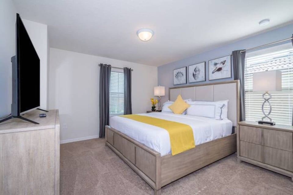 Spacious bedroom with king-size bed and stylish coastal décor
