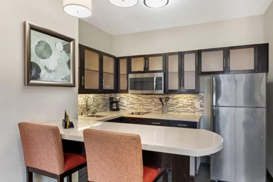 Whip up quick meals in the kitchen with a full-size fridge and microwave.