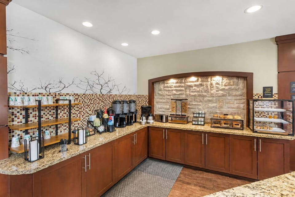 Grab a cup from the self-serve coffee station and browse pastries laid out along the stone-tiled counter.
