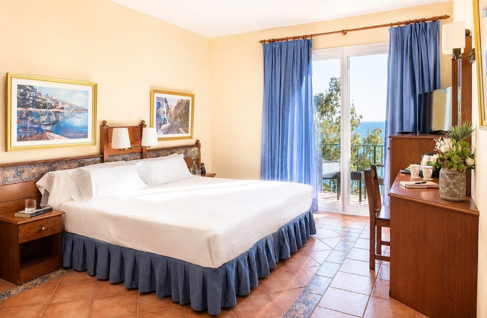 Triple room with comfortable beds and sea-facing outlook