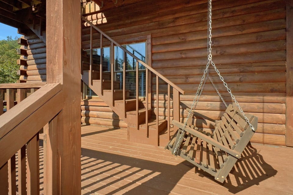 Cabin with Porch Swing and Picnic Table