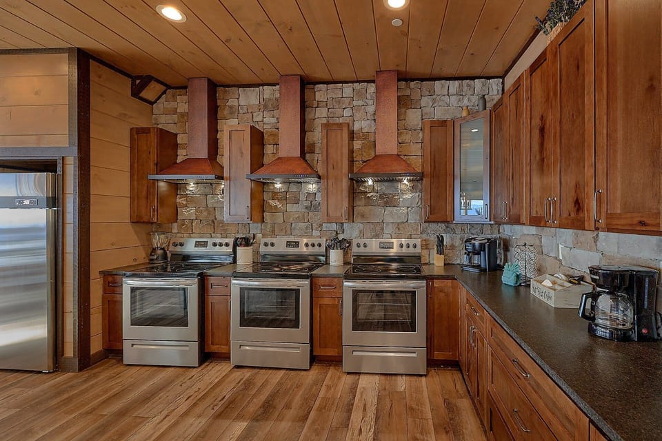 3 Ovens in kitchen of 15 bedroom cabin rental