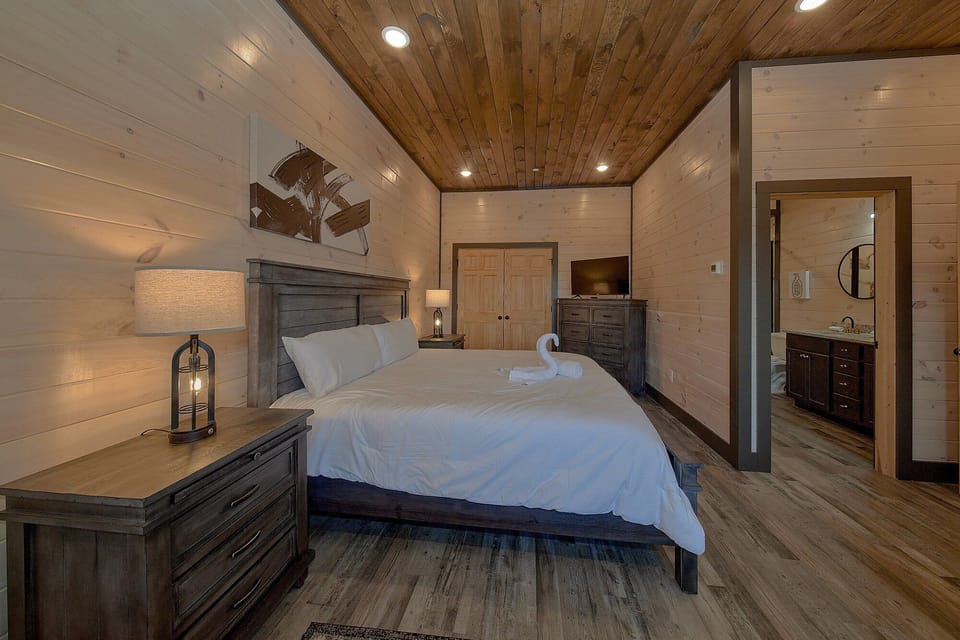 King bedroom with master bath in 3 bedroom cabin