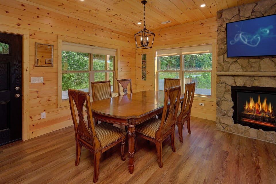 Dining room with fireplace in 3 bedroom cabin