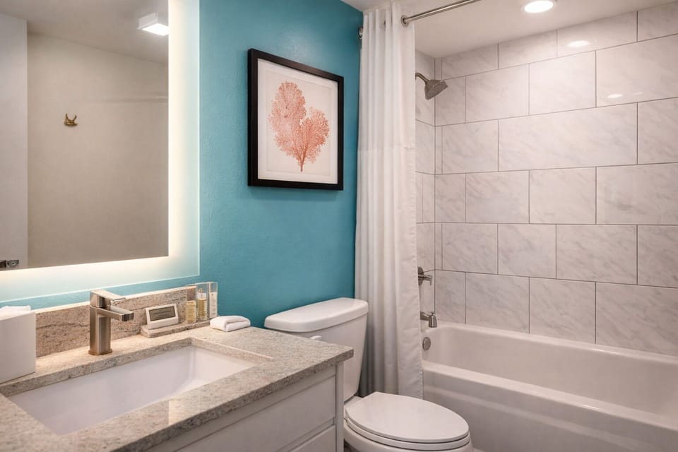 Refresh after the beach in a clean, tiled bath.