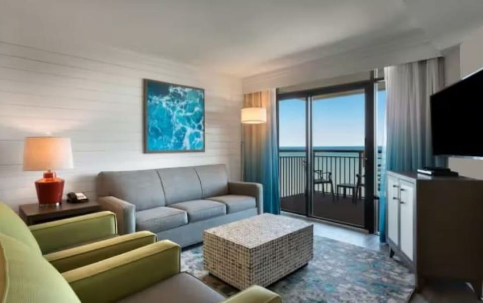 Relax in the lounge with balcony views and soft lighting.