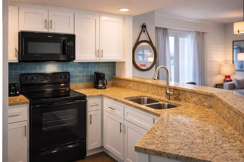 Cook effortlessly with granite counters and a full kitchen setup.