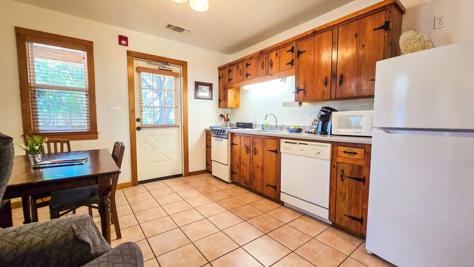 The ground floor studio’s eat-in kitchen is well equipped for an unforgettable getaway​