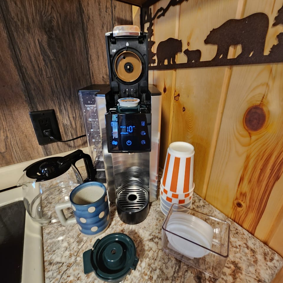 Coffee station with to-go cups. Makes iced and hot coffee, k-cups or pots.