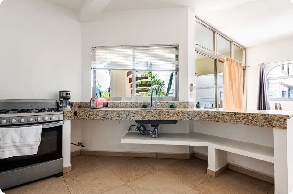 Kitchen and apartment entrance. 