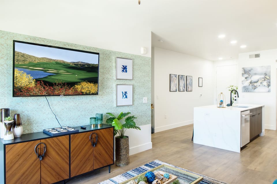 This bright and airy living room boasts an open layout that effortlessly blends comfort and sophistication, perfect for both relaxing and entertaining.