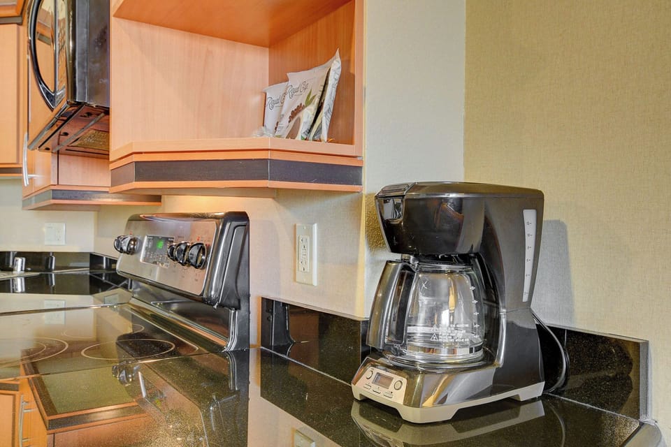 Family Suite, City View | Private kitchen | Coffee/tea maker, full-size fridge, microwave, oven