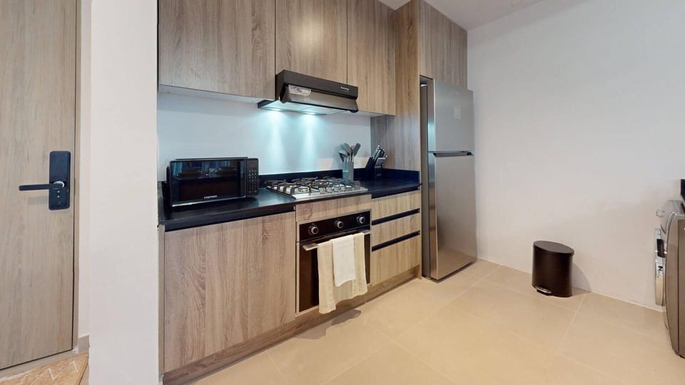 Luxury Apartment, Balcony, Garden View | Private kitchen | Fridge, microwave, oven, stovetop