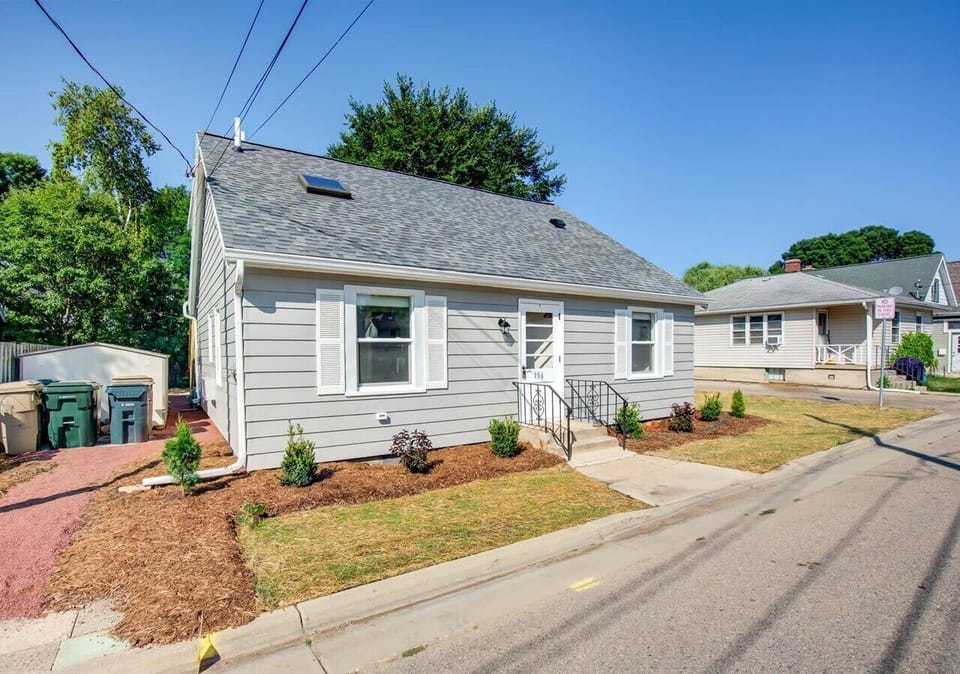 Well-maintained exterior with updated siding, a newer roof, and tidy landscaping.