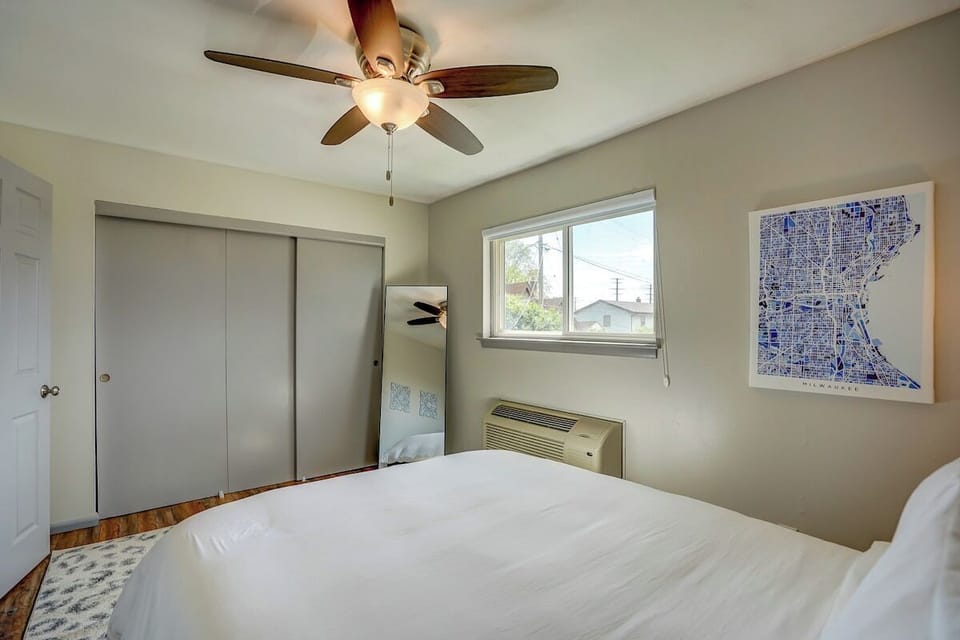 Bedroom with closet and full length mirror