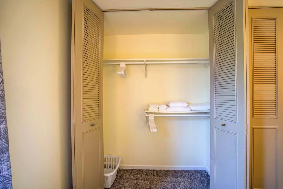 Large closet with fresh linens, ample hanging space, and storage to keep your stay neat and organized.