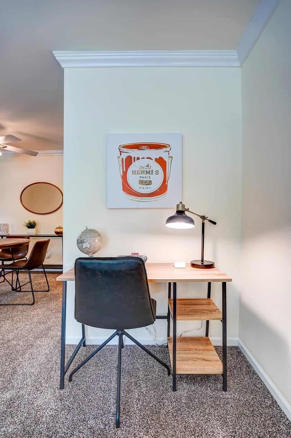 Dedicated workspace featuring a modern desk, ergonomic chair, and warm lighting—perfect for remote work or study sessions.
