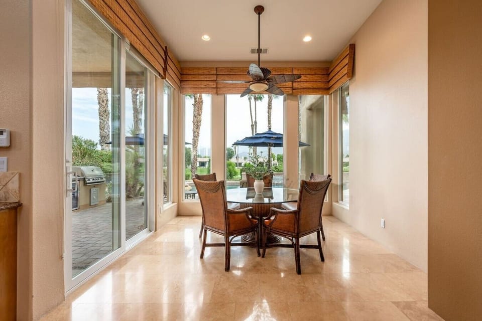 Fully stocked kitchen: stainless steel appliances and large island, 3 bar stools, designated work desk and chair, walk-in pantry, kitchen nook with 5-person round table