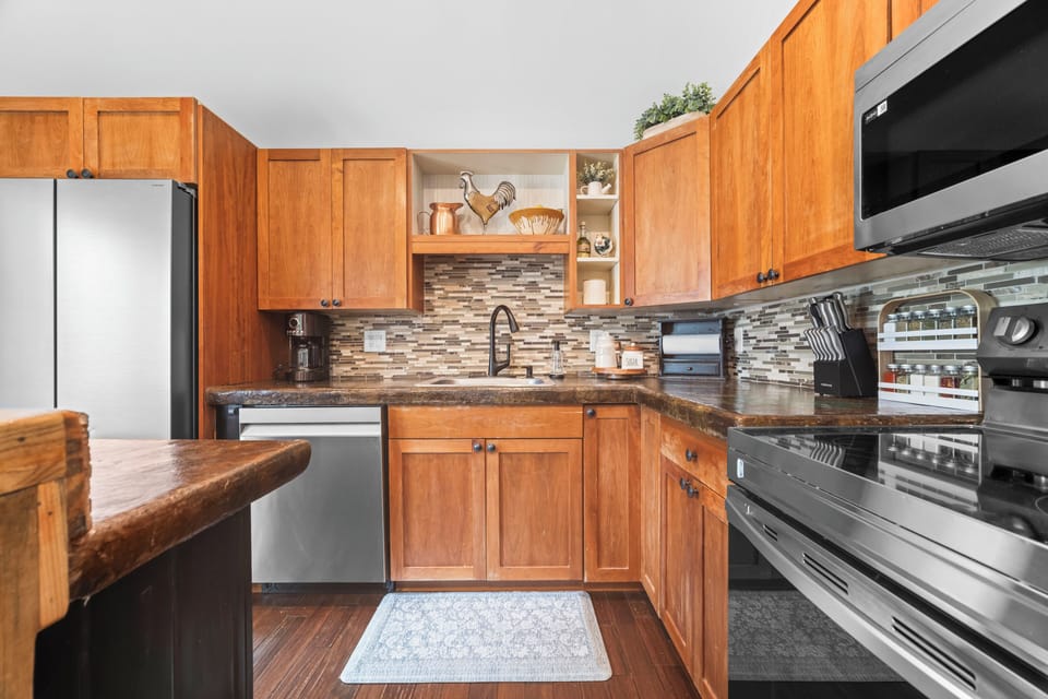 Well-equipped kitchen with generous storage, modern appliances, and plenty of counter space.