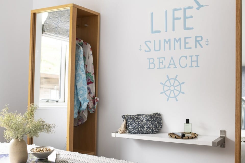 Bedroom with coastal decor at Anemone Porthtowan