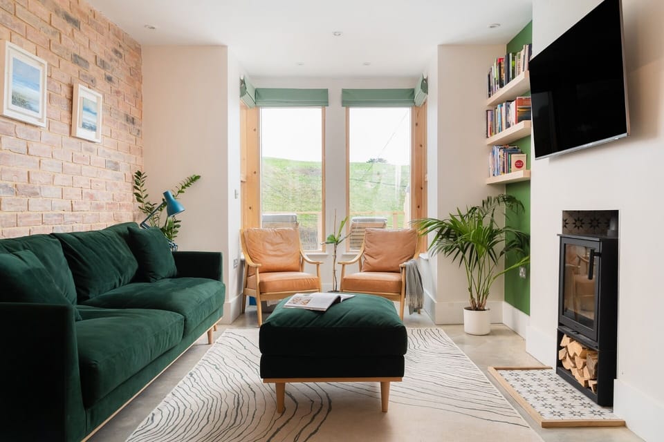 Living space with log burner at Beachspace holiday home Crantock