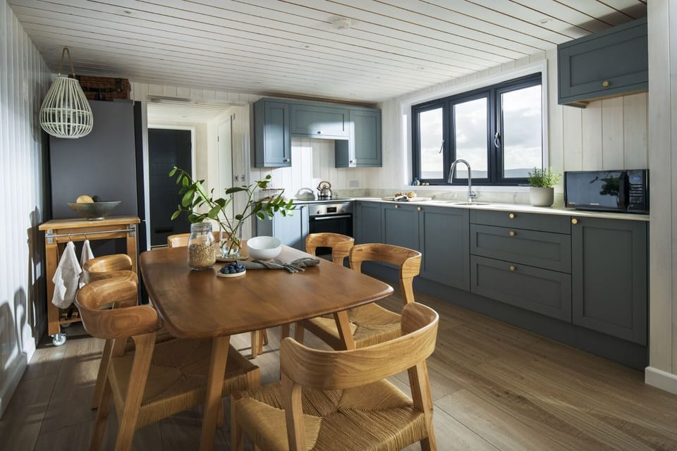 Kitchen and dining table at Blue Haze holiday home Gwithian Cornwall